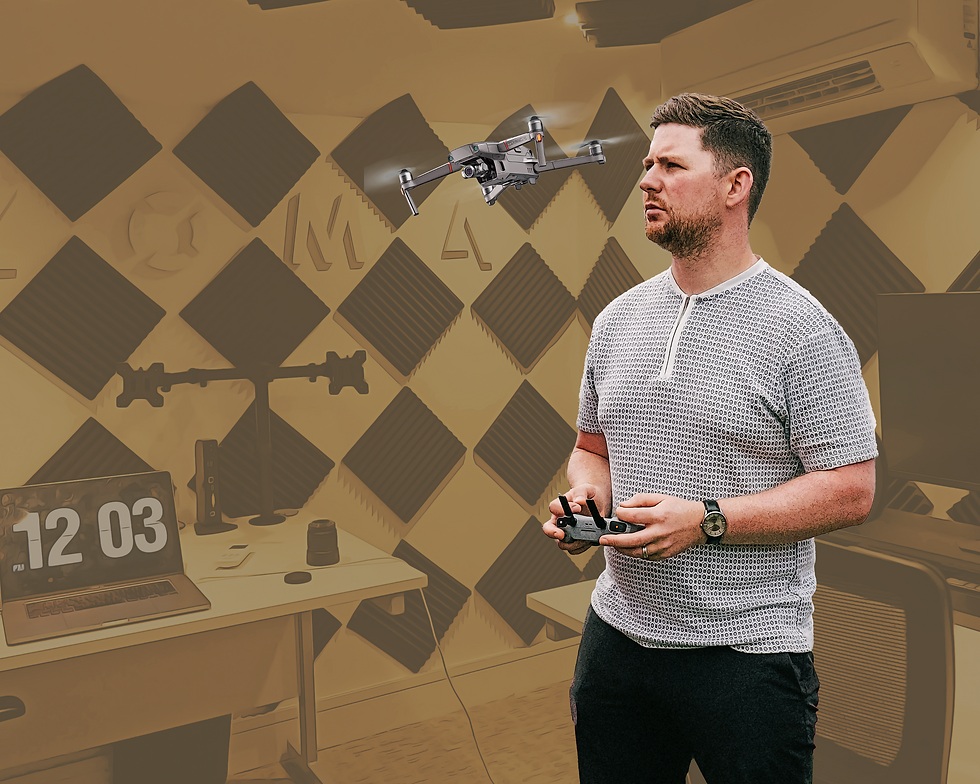Richie Naylor, Content Director at ZOMA, operating a drone in a creative studio with acoustic panels, showcasing content creation technology and workspace setup.